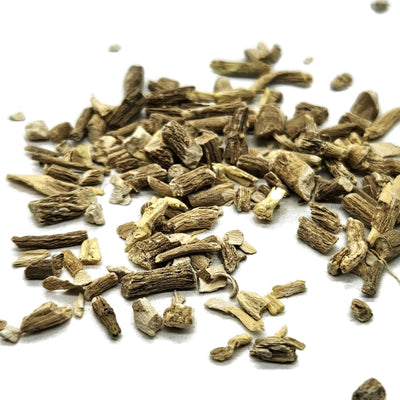 A pile of ashwagandha root cut and sifted on a white background