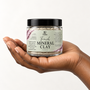  model’s hand holding a 4 oz jar of French Mineral Clay.
