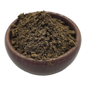 Ceramic brown bowl with a pile of 7 blend mushroom powder