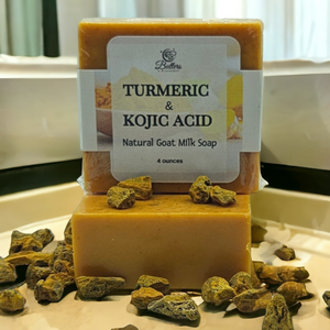 2 bars of turmeric and kojic acid soap surrounded by dried turmeric root
