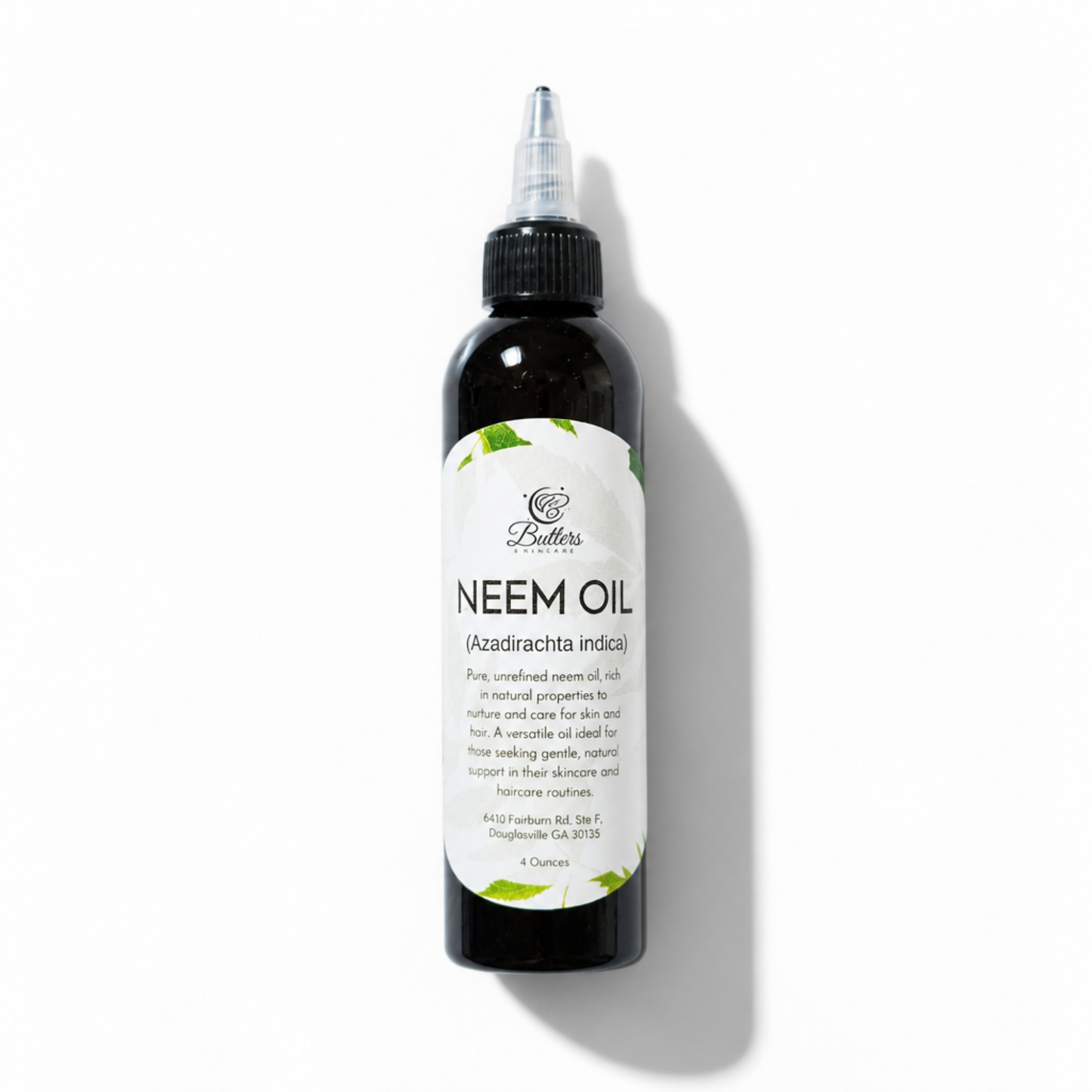 Neem oil bottle with label on a white background